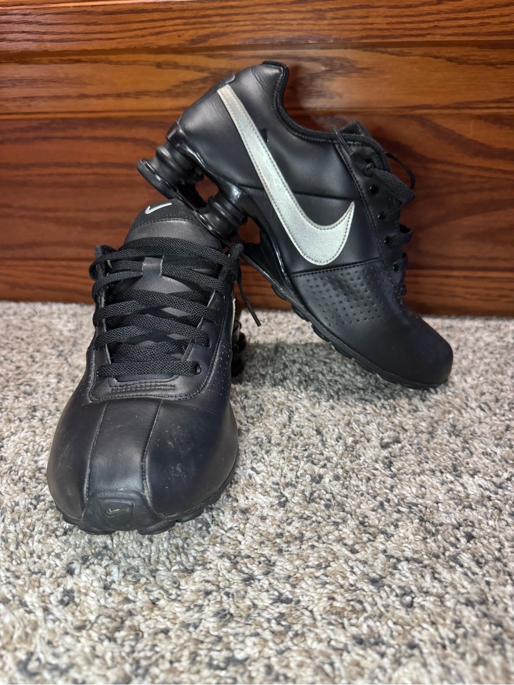 Nike Black Athletic Shoes with Silver Swoosh